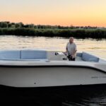 Lifestyle 727 Tender, boot varend bij zonsondergang
